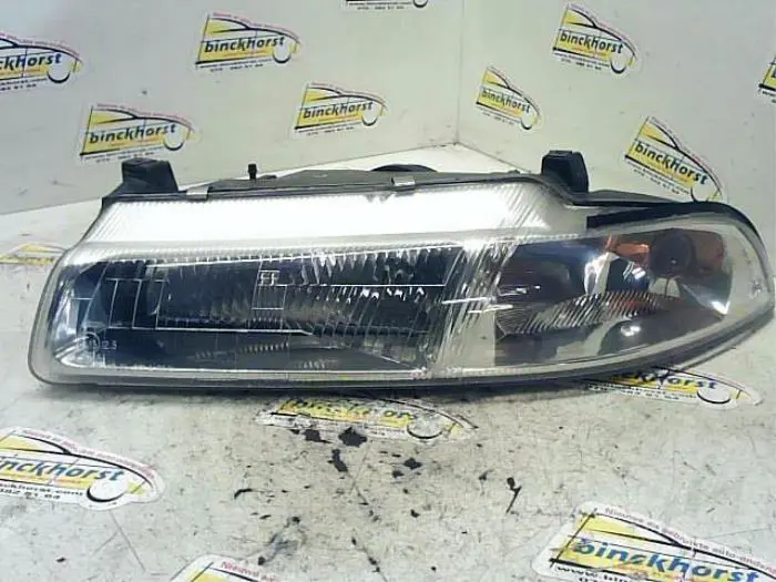 Headlight, left Chrysler Stratus