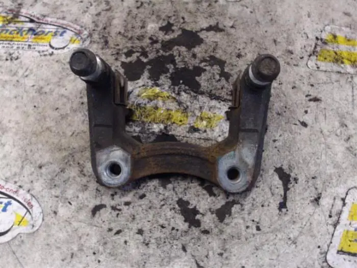 Rear brake calliperholder, left Fiat Sedici