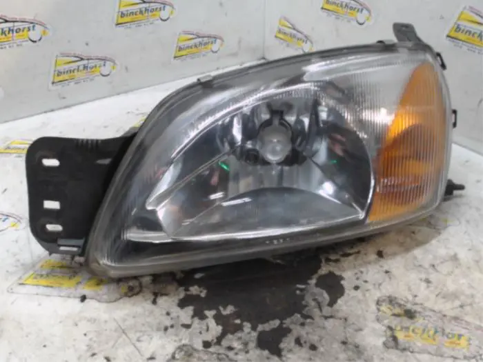 Headlight, left Ford Courier