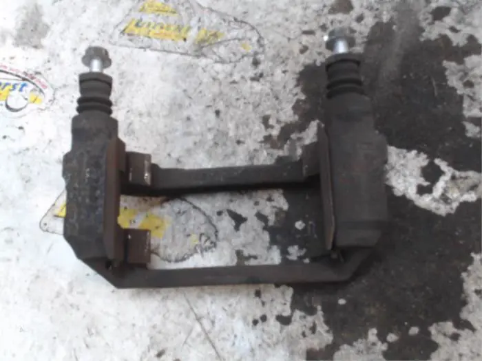 Front brake calliperholder, left Ford Fiesta